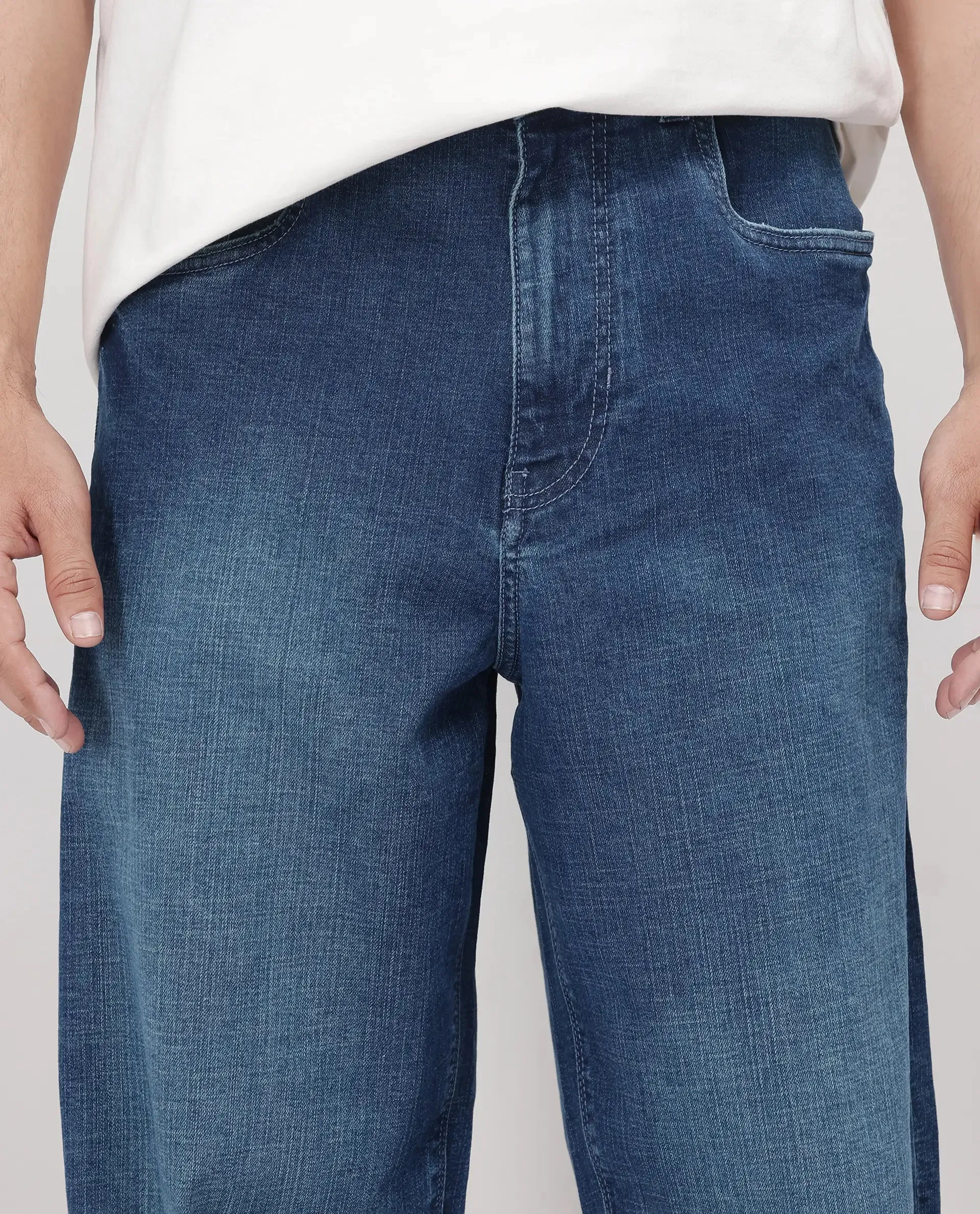 Rare Rabbit Men Jace Blue Cotton Blend Fabric Button And Zip Closure Baggy Fit Plain Jeans